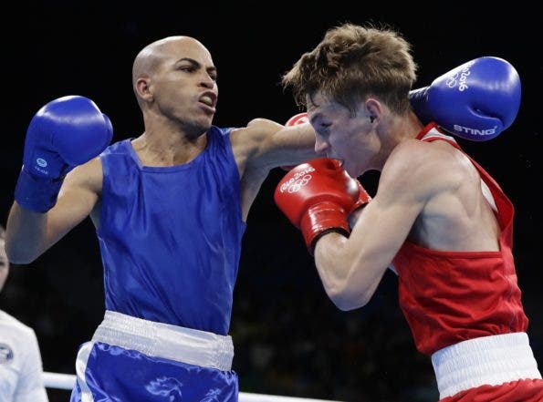 Dominican Republic's Hector Luis Garcia Mora, left, fights Belarus' Dzmitry Asanau during a men's bantamweight 56-kg preliminary boxing match at the 2016 Summer Olympics in Rio de Janeiro, Brazil, Wednesday, Aug. 10, 2016. (AP Photo/Frank Franklin II)