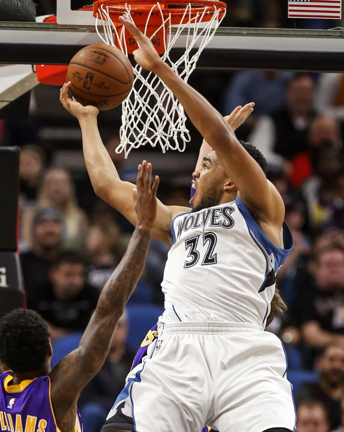Minnesota Timberwolves center Karl-Anthony Towns (32) shoots against the Los Angeles Lakers in the second half of an NBA basketball game Sunday, Nov. 13, 2016, in Minneapolis. The Timberwolves won 125-99. (AP Photo/Bruce Kluckhohn)
