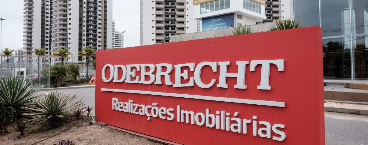 (FILES) This file photo taken on June 23, 2016 shows a logo of Brazilian construction company Odebrecht at the Olympic and Paralympic Village in Rio de Janeiro, Brazil. Brazil-based construction giant Odebrecht on December 21, 2016 agreed to pay fines of at least $2.6 billion to US, Brazilian and Swiss authorities, in what the US is calling the largest foreign bribery case in history. The US Justice Department said the conglomerate pled guilty to paying hundreds of millions to bribe government officials in countries on three continents.
 / AFP / YASUYOSHI CHIBA