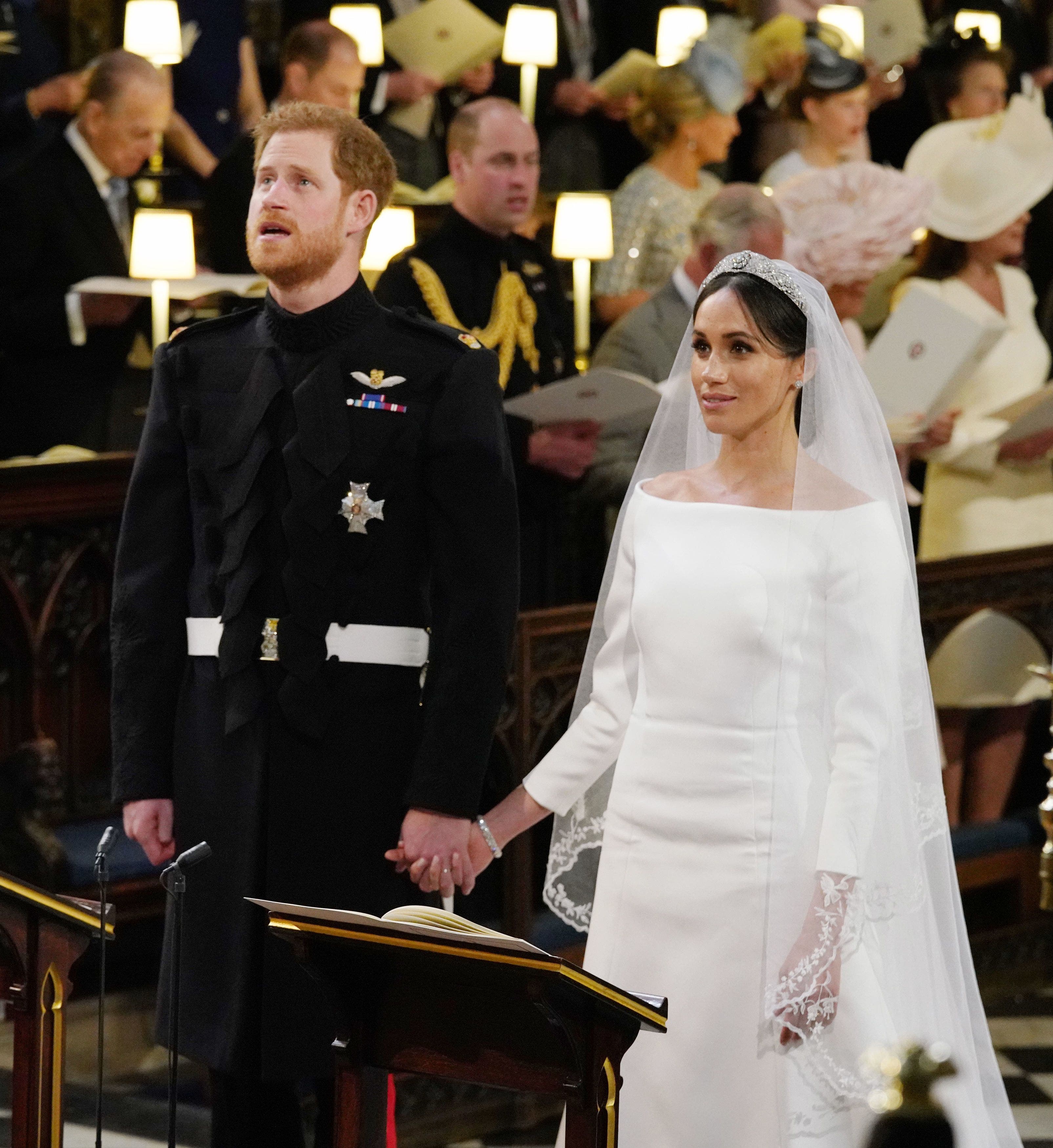 El prÃ­ncipe Harry, Duque de Sussex (L) y la prometida estadounidense del prÃ­ncipe heredero Harry Meghan Markle se reÃºnen en el Altar Mayor durante su ceremonia de boda en la Capilla de San Jorge, en el Castillo de Windsor, en Windsor, el 19 de mayo de 2018. / AFP