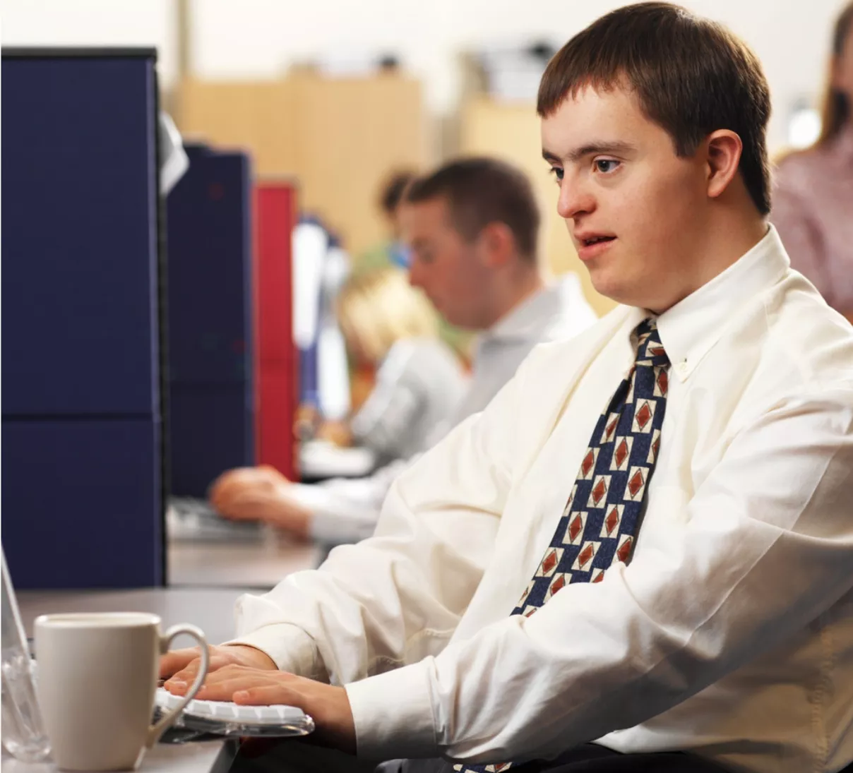 Man with Down Syndrome Working in an Office