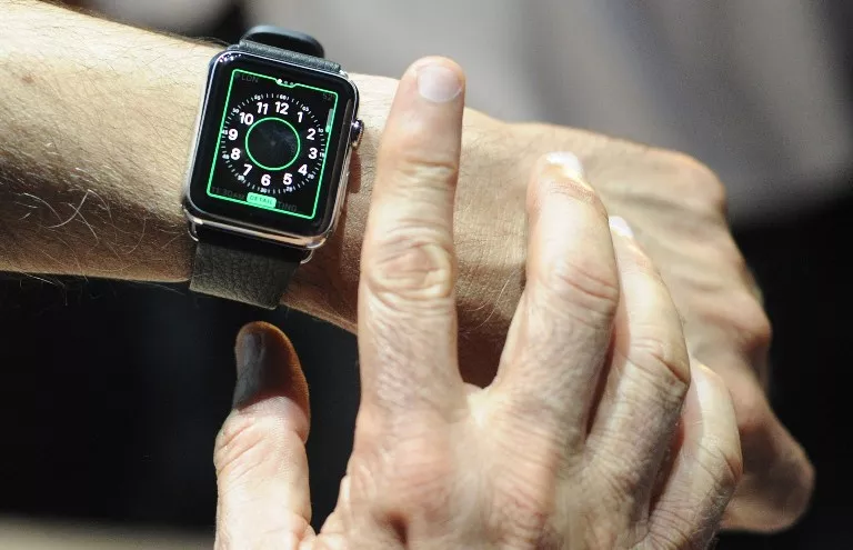 An Apple employee demonstrates how to use an Apple Watch during an Apple media event at the Yerba Buena Center for the Arts in San Francisco, California on March 09, 2015. AFP PHOTO / JOSH EDELSON