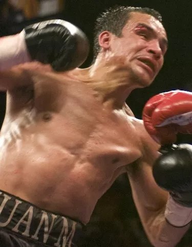 BOXING: PACQUIAO DETHONES MARQUEZ TO CLAIM SUPER FEATHER TITLE