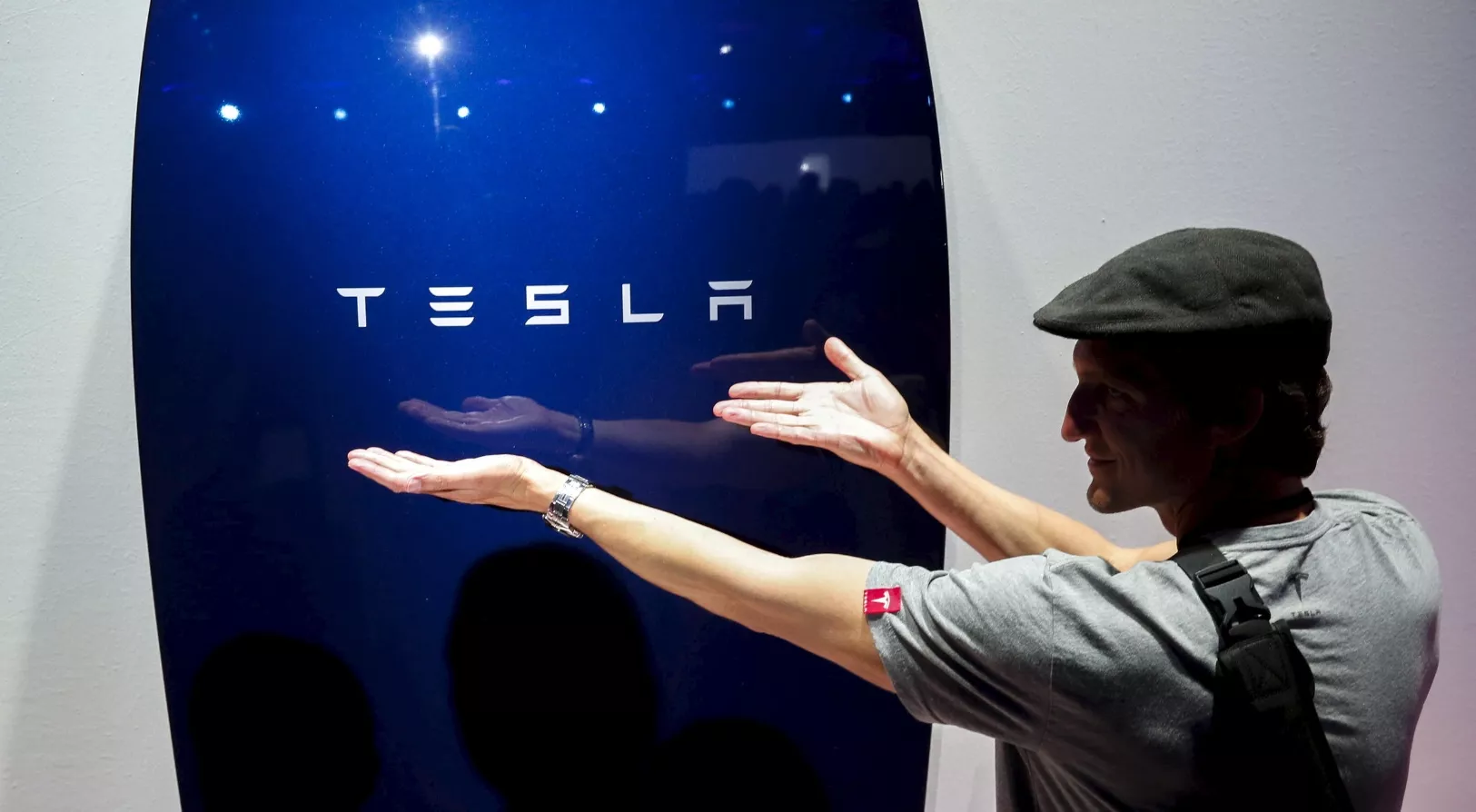 Attendees take pictures of the new Tesla Energy Powerwall Home Battery during an event at Tesla Motors in Hawthorne, California