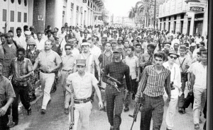 Como muchos otros dirigentes de izquierda, Amín se integró al movimiento constitucionalista durante la Guerra de Abril de 1965.