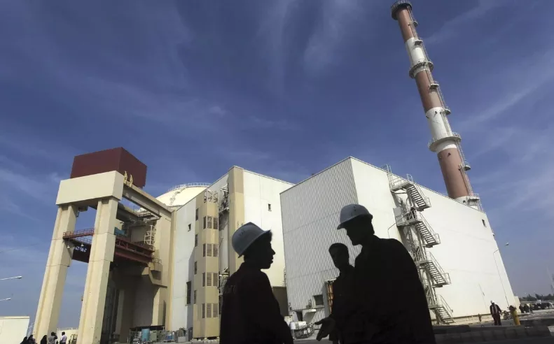 File photo of Iranian workers standing in front of the Bushehr nuclear power plant, about 1,200 km (746 miles) south of Tehran