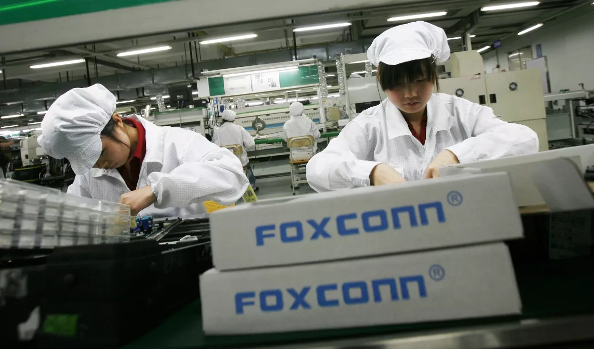 Workers are seen inside a Foxconn factory in the township of Longhua in the southern Guangdong province