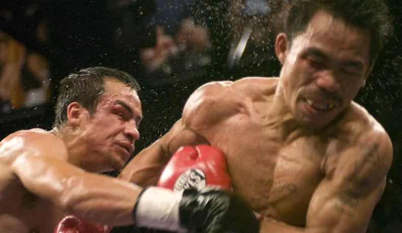 BOXING: PACQUIAO DETHONES MARQUEZ TO CLAIM SUPER FEATHER TITLE