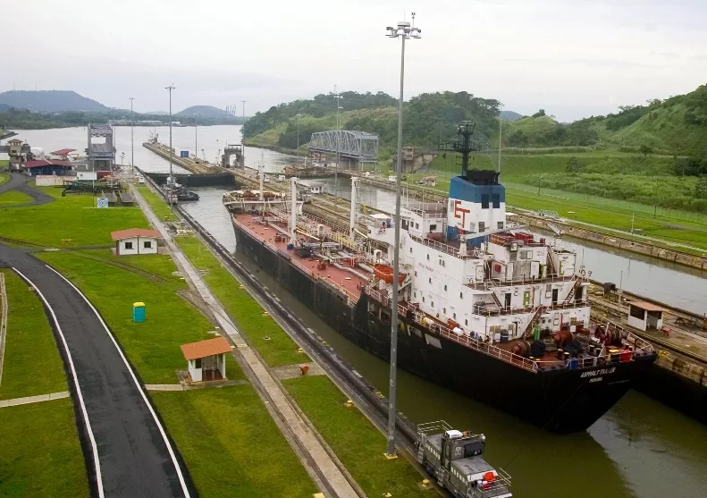 A Cargo ship leaves the Panama Canal Miraflores locks, heading toward the Pacific Ocean, in Panama C..