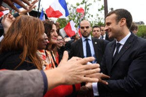 New French President Emmanuel Macron greets supporters after a ceremony at the Arc of Triomphe following his formal inauguration ceremony as French President Sunday, May 14, 2017 in Paris. Macron was inaugurated as France's new president at the Elysee Palace in Paris, and immediately launched into his mission to shake up French politics, world economics and the European Union. (Alain Jocard, Pool via AP)