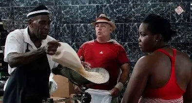People wait in line to buy rice in a state store in downtown Havana People wait in line to buy rice in a state store in downtown Havana