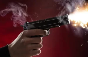 Pistola en manos
