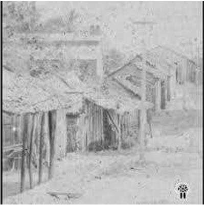 Viviendas de mastril de carrizo, típica de Los Alcarrizos a comienzos del siglo XX. Entrada al lugar. Foto Lucas Reyes.